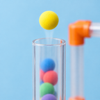 Foam ball floating on air above a clear tube